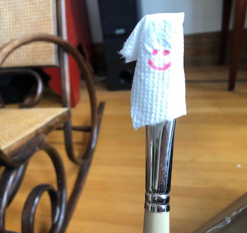 paintbrush with paper towel cover